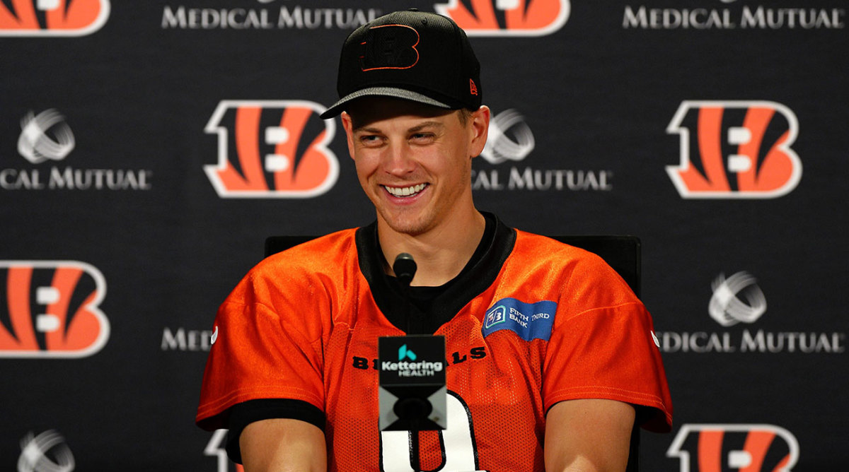Joe Burrow smiles at a preseason press conference.